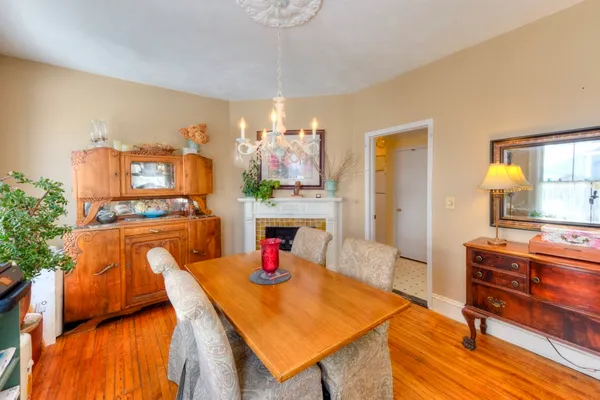 a dining room with furniture and a chandelier