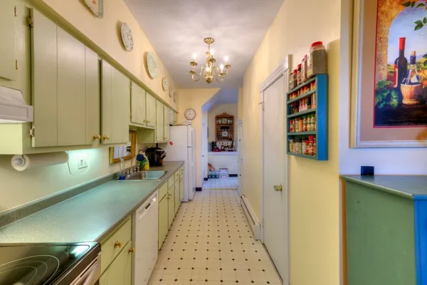 a view of a kitchen cabinets and a sink