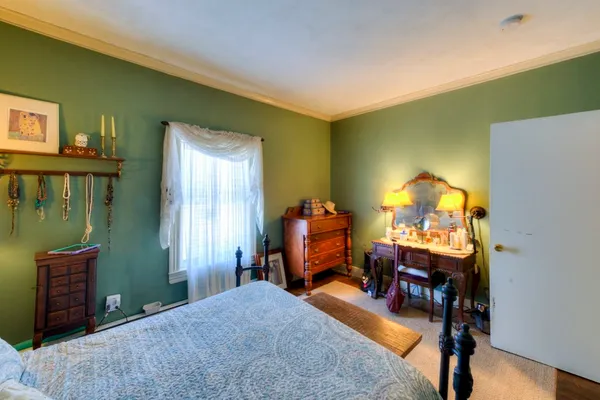 a bed room with a bed and a lamp