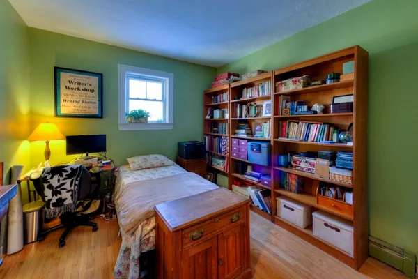 a room with furniture and book shelf