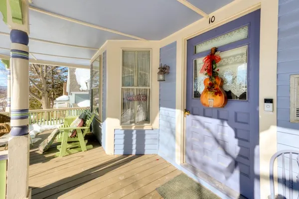 a bedroom with furniture and large window