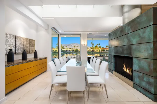 a kitchen with a sink a counter top space stainless steel appliances and a window