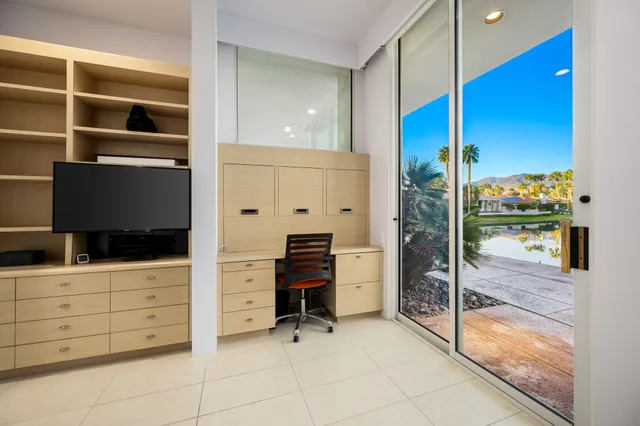 a view of a lake with a houses in the back