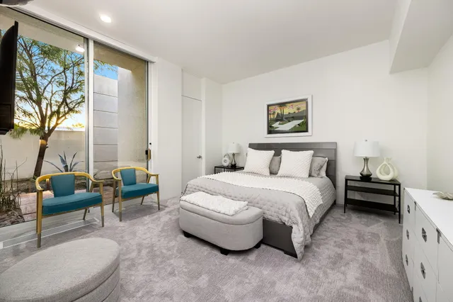 a lobby with furniture and garden view