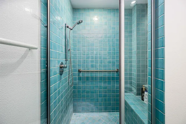 a lobby with furniture and floor to ceiling window