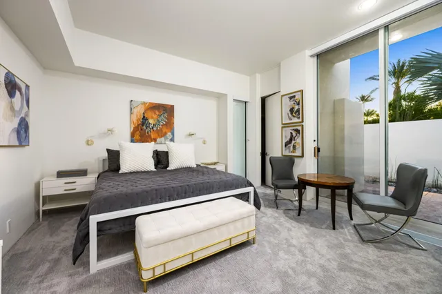 a view of a patio with table and chairs potted plants with wooden floor