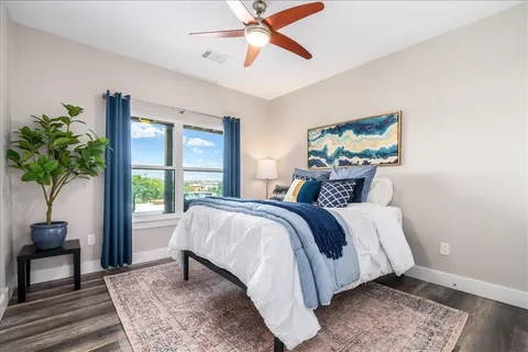 a bedroom with a bed and a window