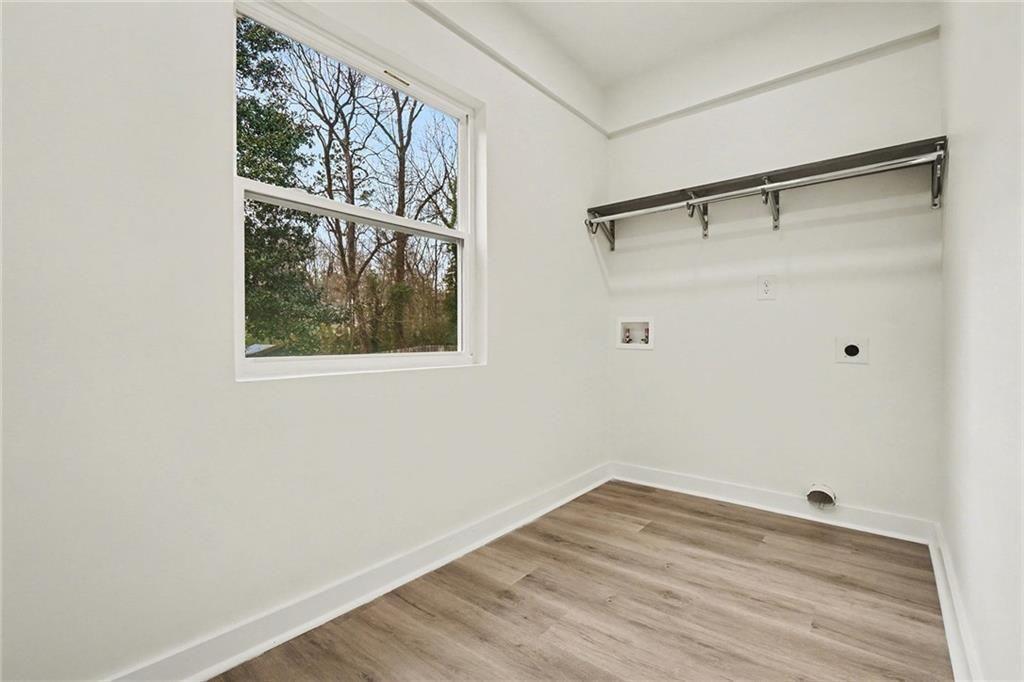 1684 Kenmore Street Southwest Atlanta, GA 30311 - Photo 18 of 30 a view of a small space with wooden floor and a window