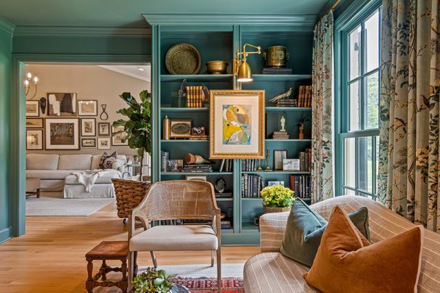 a view of a dining room with furniture and window