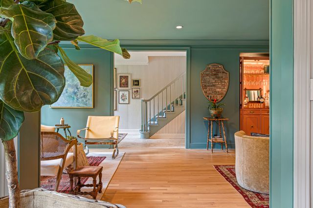 a bathroom with a tub and a mirror