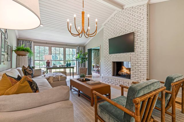 a spacious bedroom with a large bed and a wooden floor