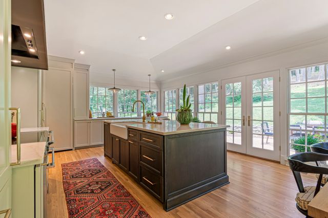 a view of a patio with a table chairs and a backyard