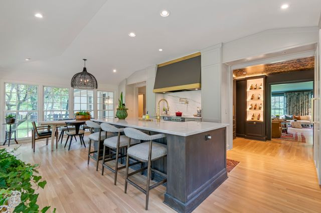 a view of a patio with a table chairs and a backyard