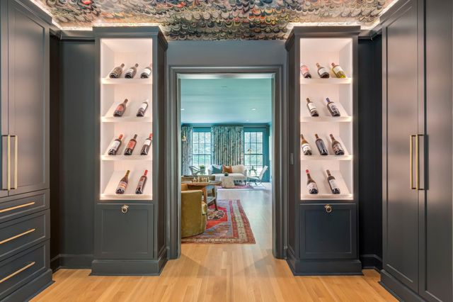 a house with green field in front of it