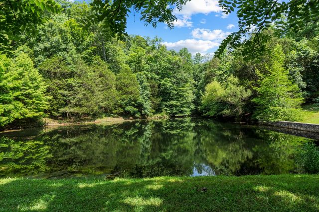 a front view of a house with a yard table and chairs