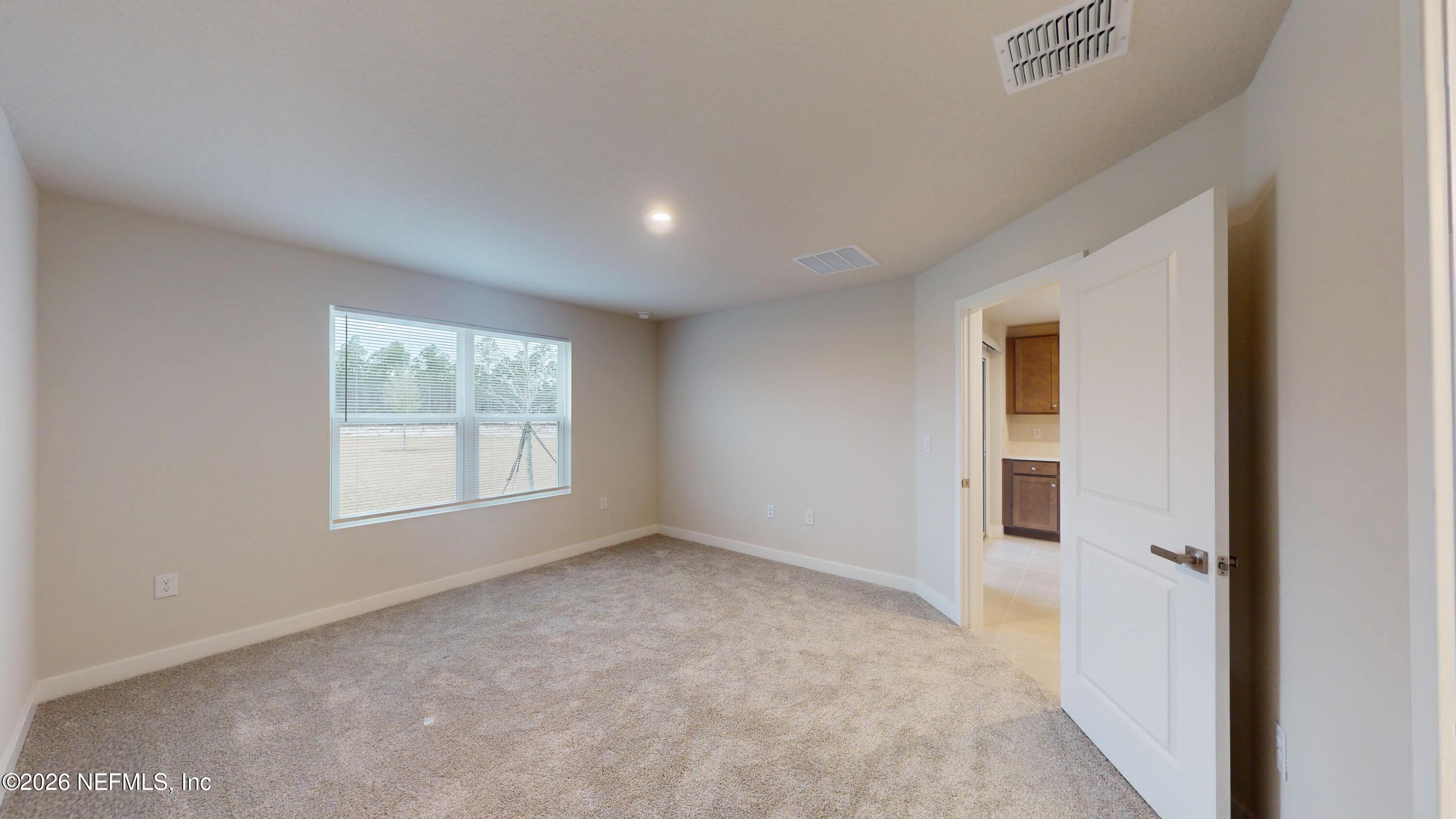 55 Gaston Court St. Augustine, FL 32092 - Photo 17 of 41 a view of an empty room with a window