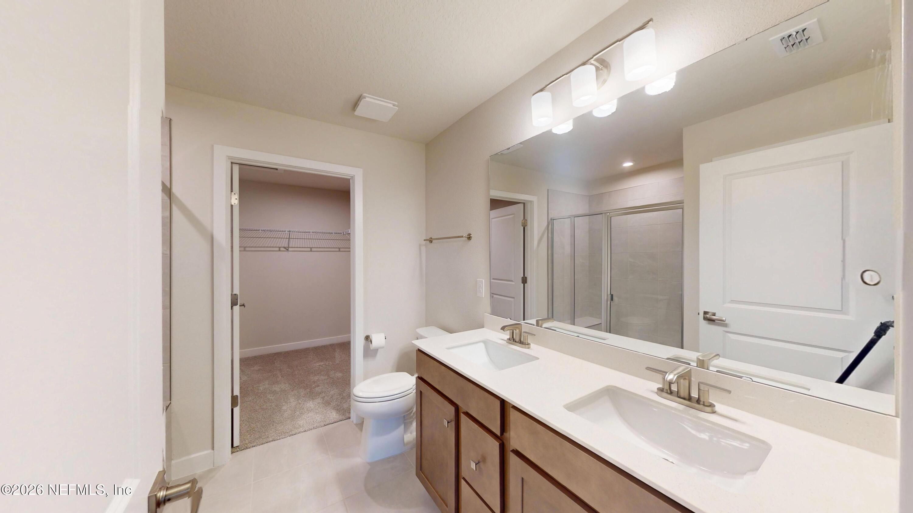 55 Gaston Court St. Augustine, FL 32092 - Photo 18 of 41 a bathroom with a sink double vanity and a mirror