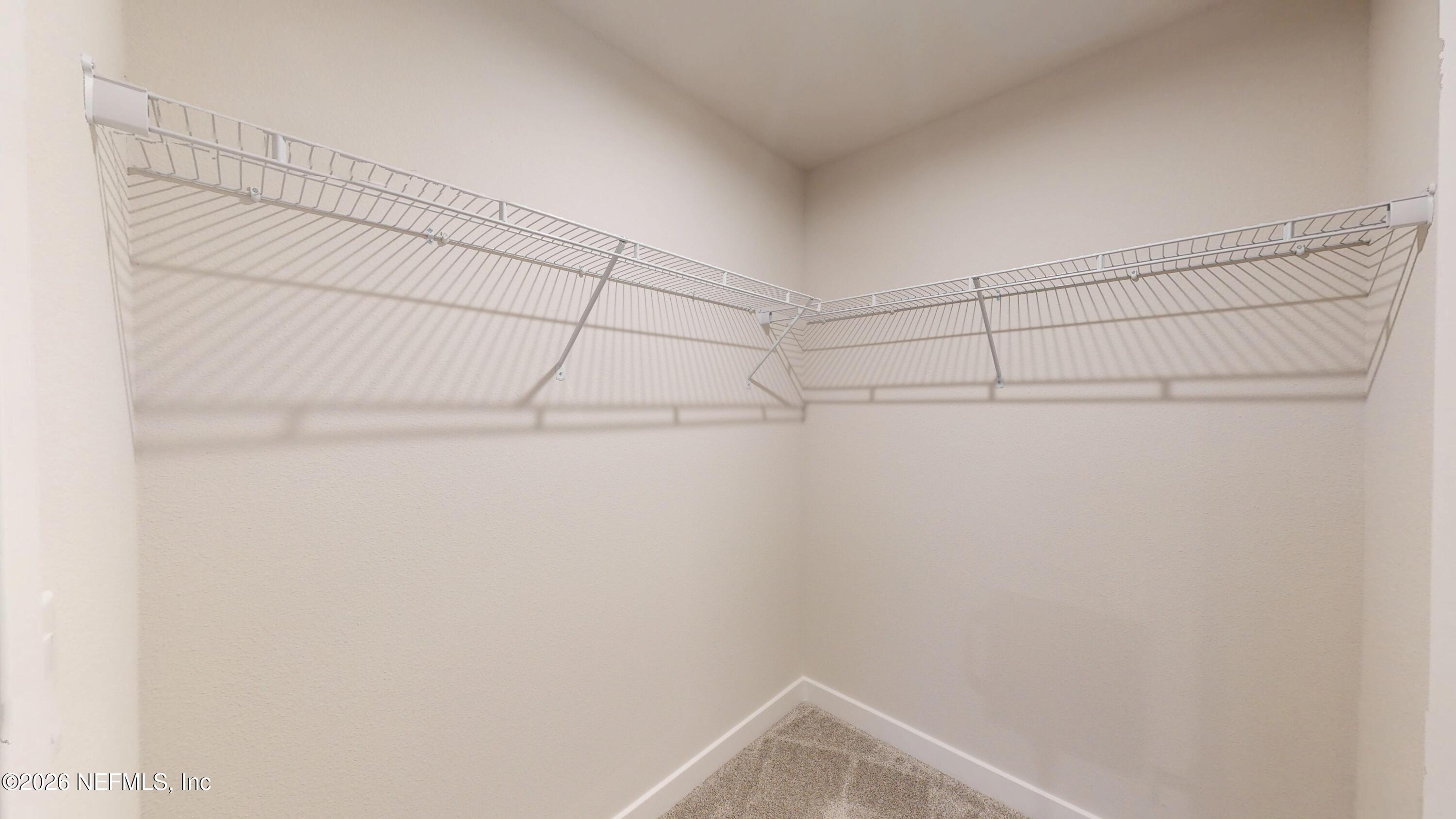 55 Gaston Court St. Augustine, FL 32092 - Photo 28 of 41 a view of a room with racks on the wall