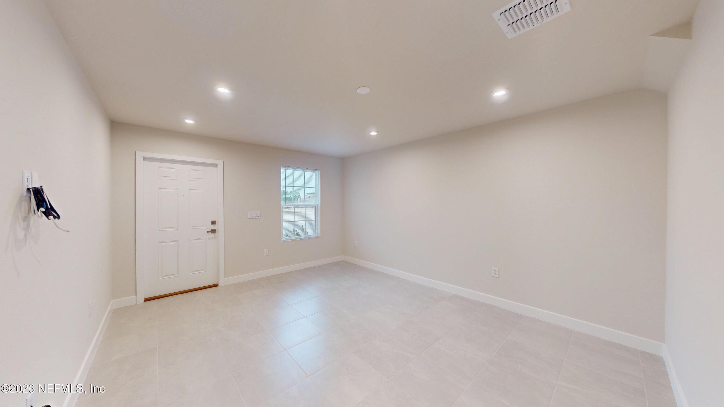55 Gaston Court St. Augustine, FL 32092 - Photo 3 of 41 an empty room with windows and closet