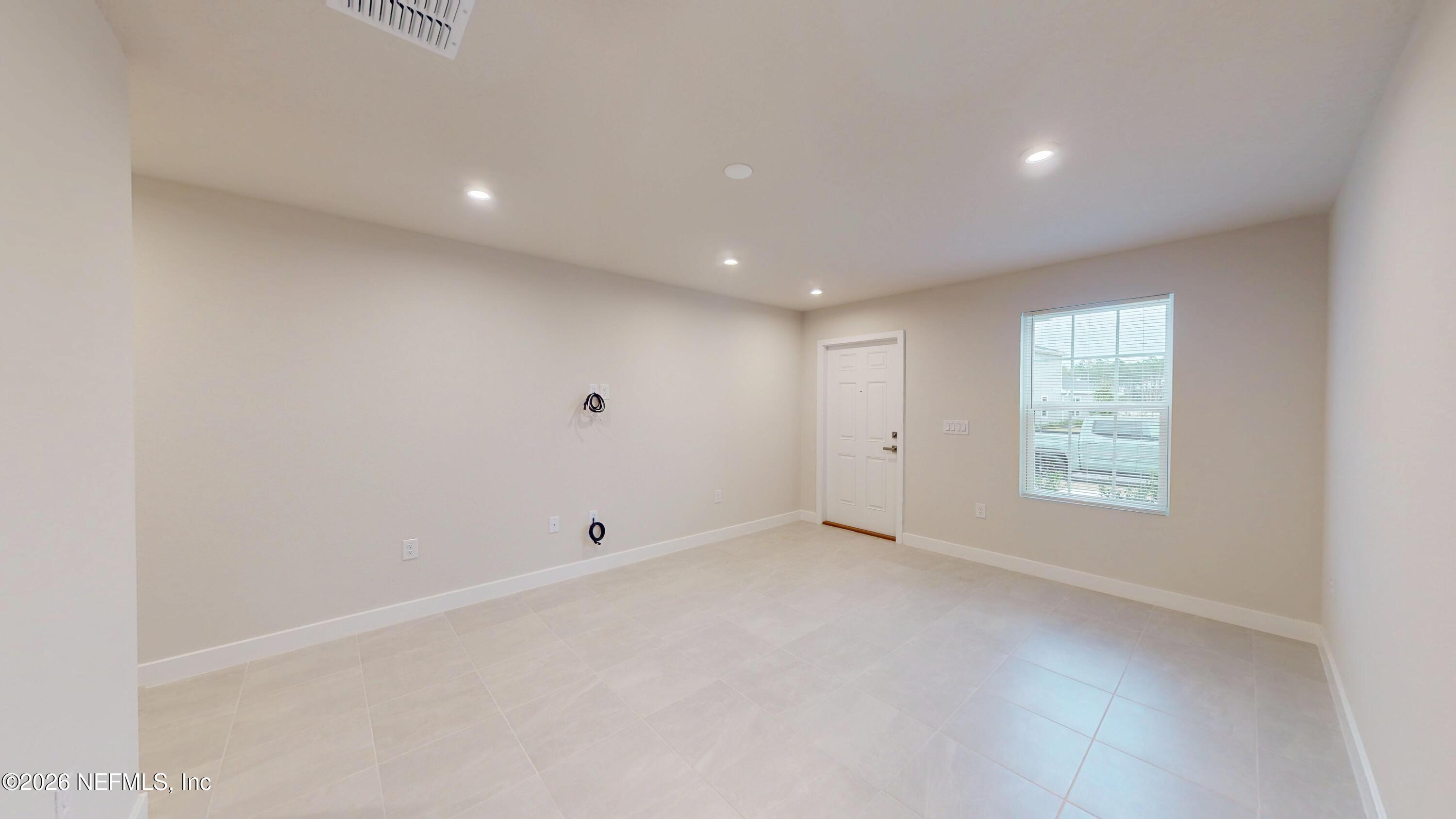 55 Gaston Court St. Augustine, FL 32092 - Photo 4 of 41 a view of an empty room with a window