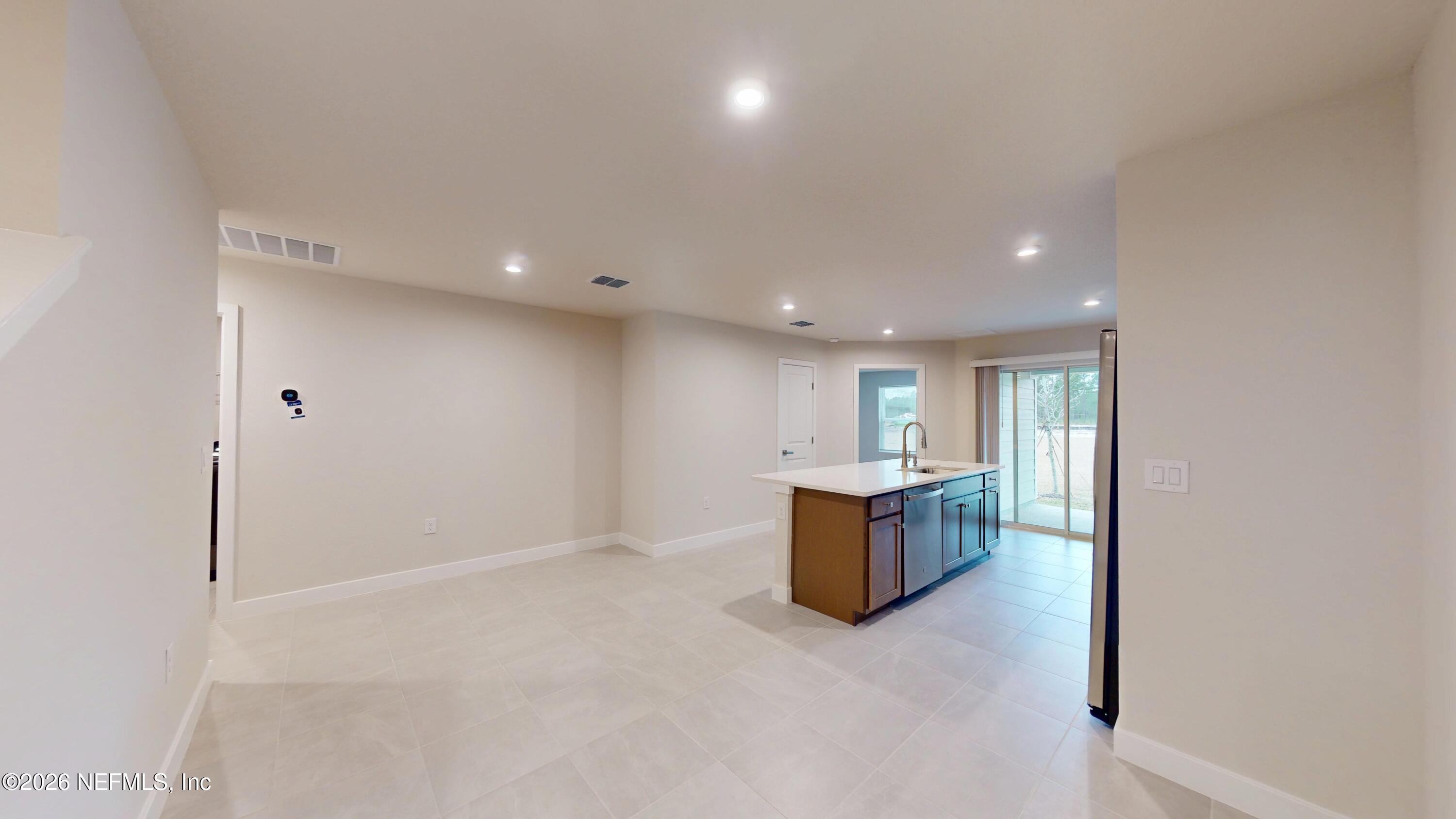 55 Gaston Court St. Augustine, FL 32092 - Photo 7 of 41 a view of kitchen and kitchen with granite countertops