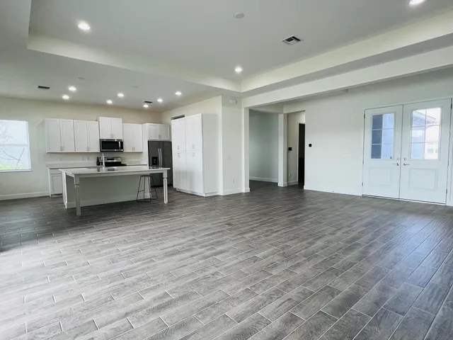 a view of kitchen with wooden floor