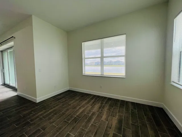 a view of a pathway both side of a house