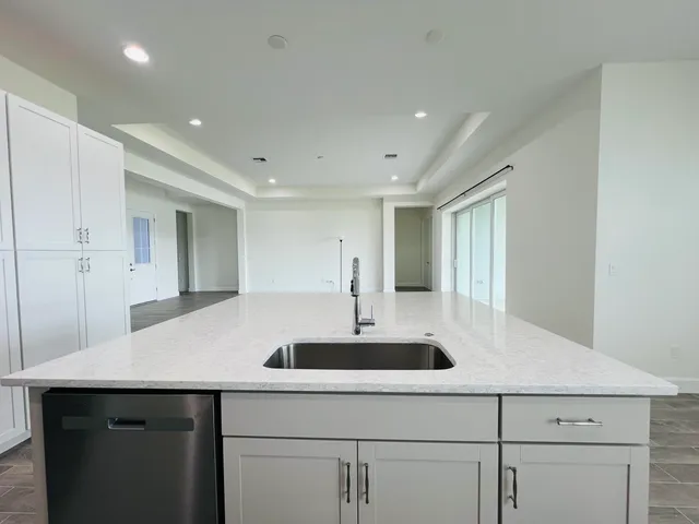 a kitchen with a sink and cabinets