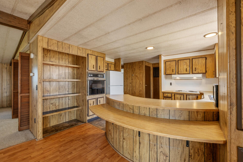 31410 Union Street Bonanza, OR 97623 - Photo 6 of 37 a view of a kitchen with furniture and wooden floor