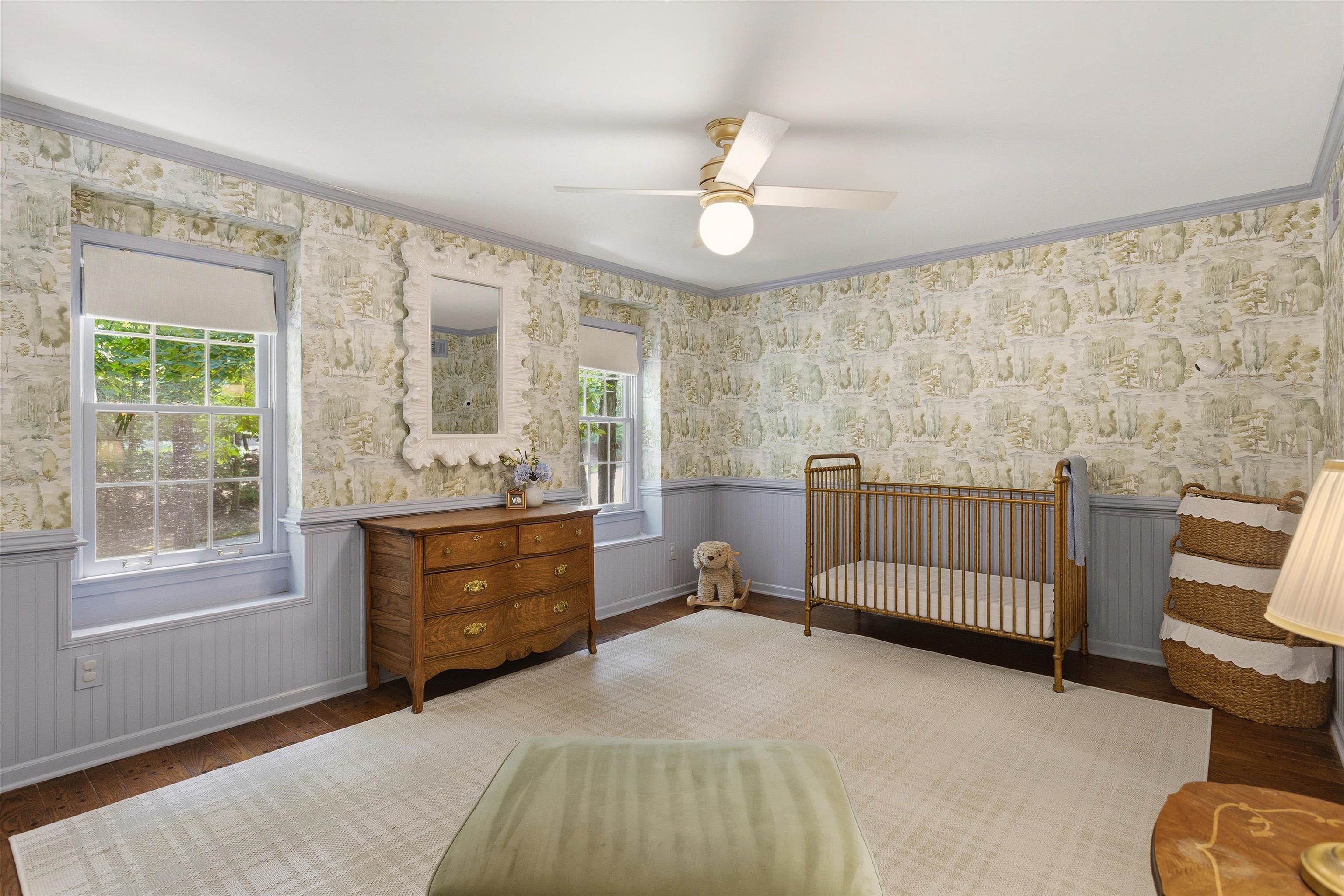5828 Haymarket Road Memphis, TN 38120 - Photo 29 of 40 Room featuring patterned wallpaper, light blue wainscoting, and wood-finish flooring