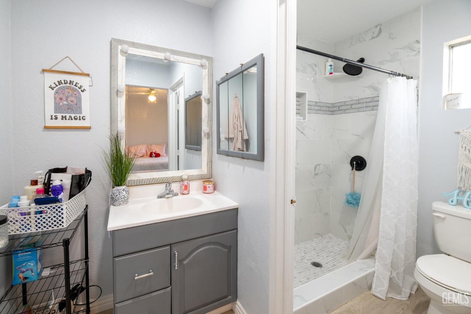 Undisclosed Address Delano, CA 93215 - Photo 12 of 19 a bathroom with a sink toilet and shower