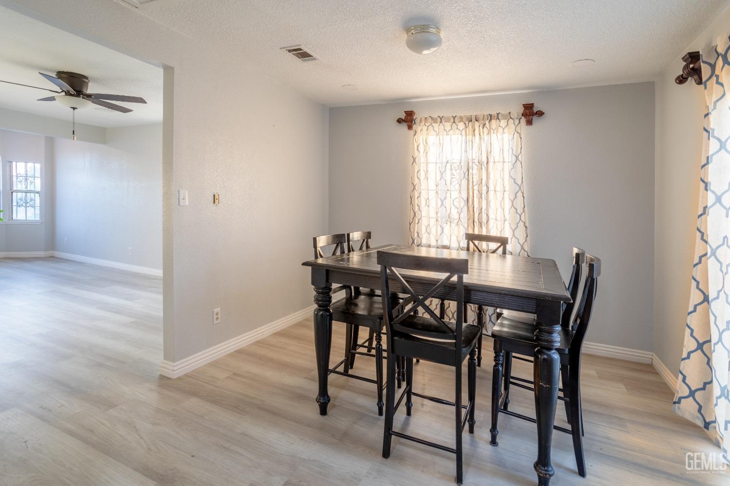 Undisclosed Address Delano, CA 93215 - Photo 6 of 19 a view of a dining room with furniture and window