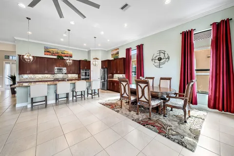 a group of people sitting at kitchen area