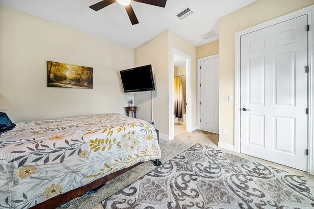 a bedroom with a bed and a television