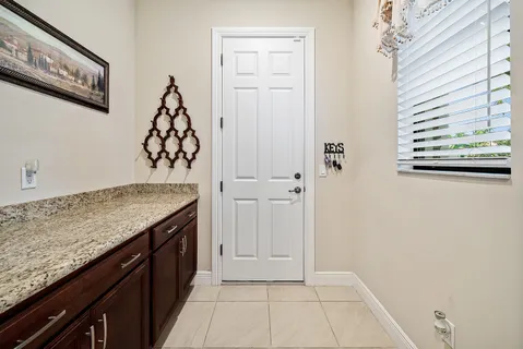 a view of a kitchen cabinets and a stove top oven