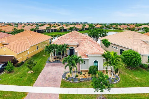 an aerial view of multiple houses with yard