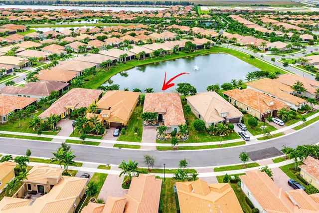an aerial view of house with yard