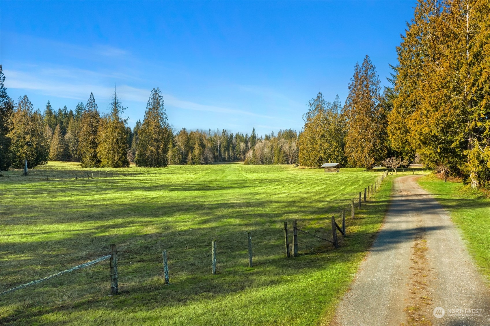 13106 Reiner Road Monroe, WA 98272 - Photo 2 of 37 a view of a golf course with a lake