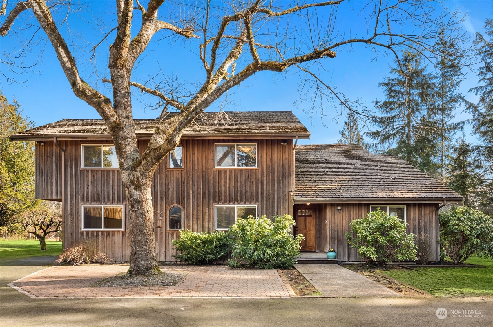 13106 Reiner Road Monroe, WA 98272 - Photo 5 of 37 a front view of a house with a garden