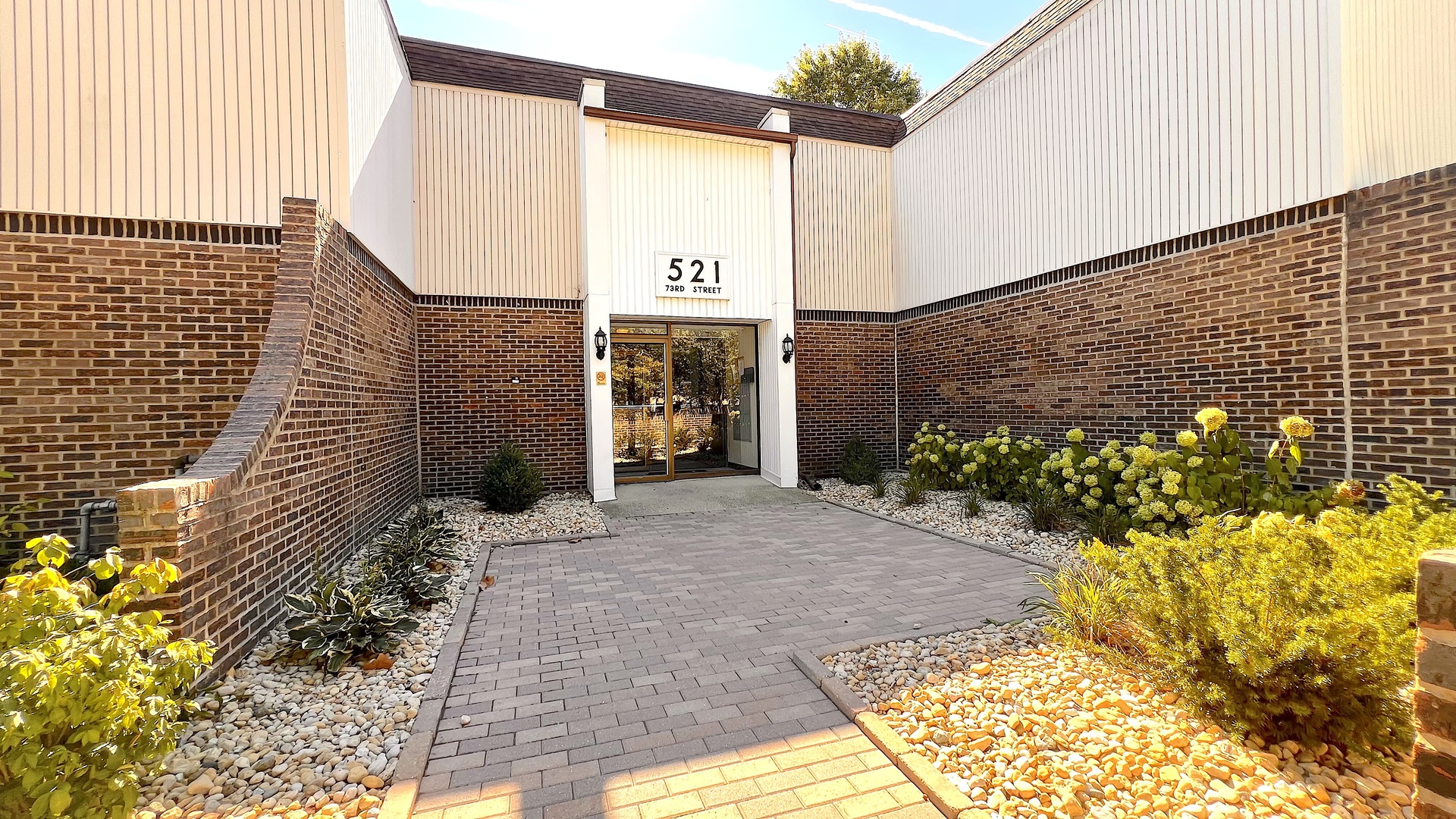 521 73rd Street, Unit 105 Downers Grove, IL 60516 - Photo 1 of 17 a entryway view with a outdoor space