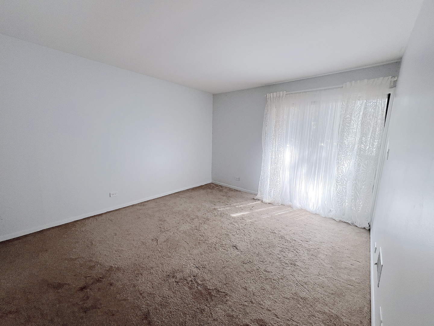 521 73rd Street, Unit 105 Downers Grove, IL 60516 - Photo 10 of 17 a view of an empty room and window