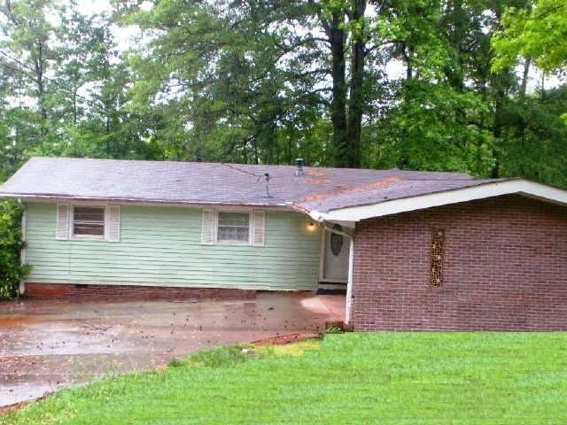 1869 Burning Tree Drive Decatur, GA 30032 - Photo 1 of 1 a backyard of a house with lots of green space