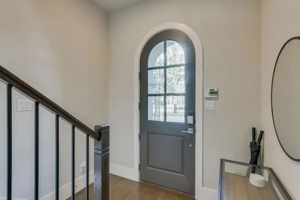 a view of an entryway with wooden floor