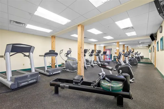 a green room with a bed and a window