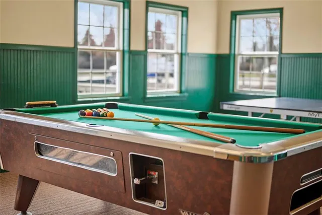 an aerial view of a house with yard swimming pool and outdoor seating