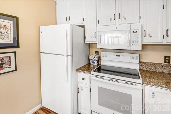 a kitchen with appliances and cabinets