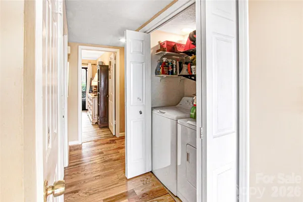a view of a hallway with a hallway and wooden floor