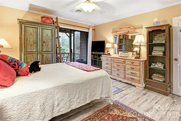 a bedroom with a bed and a television in it
