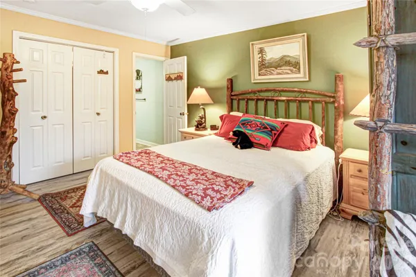 a bedroom with bed and a window