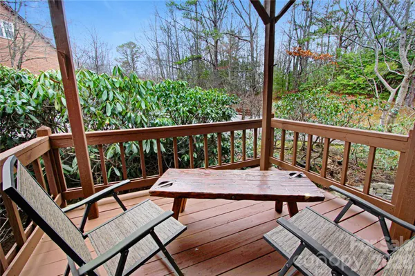 a view of a wooden bench on the deck